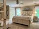 This is a bright bedroom featuring a large bed, two bedside tables and two large windows at 1425 Bascomb Dr, Raleigh, NC 27614