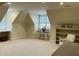 Spacious bonus room with natural light, neutral carpet, and a built in bookcase at 1425 Bascomb Dr, Raleigh, NC 27614