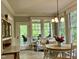 Cozy breakfast nook with bright windows and dining table at 1425 Bascomb Dr, Raleigh, NC 27614