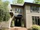 Inviting home exterior featuring a black front door, decorative shutters and brick steps leading to entrance at 1425 Bascomb Dr, Raleigh, NC 27614