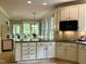 Well-equipped kitchen with white cabinetry, modern appliances, and spacious countertops at 1425 Bascomb Dr, Raleigh, NC 27614
