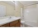 Well-lit bathroom featuring a vanity, toilet, and a shower with bathtub combo at 1432 E Stonemason Dr, Fuquay Varina, NC 27526
