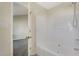 Bathroom featuring a shower with bathtub combo and neutral walls at 1432 E Stonemason Dr, Fuquay Varina, NC 27526
