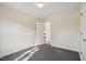 This bedroom features neutral walls, plush carpeting, and ample natural light at 1432 E Stonemason Dr, Fuquay Varina, NC 27526