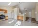 Open kitchen with stainless steel appliances, oak cabinets, tile flooring, and an eat-in bar at 1432 E Stonemason Dr, Fuquay Varina, NC 27526