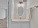 Well-maintained half-bathroom with a vanity, mirror, light fixture, and towel rack at 1442 Barton Place Dr, Raleigh, NC 27608