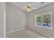 Bedroom with a window providing natural light and a ceiling fan for added comfort at 1442 Barton Place Dr, Raleigh, NC 27608