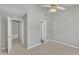 Spacious bedroom featuring neutral carpet, and ceiling fan in a well-lit space at 1442 Barton Place Dr, Raleigh, NC 27608