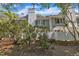 Charming home with a white chimney, gray siding, and a manicured front yard at 1442 Barton Place Dr, Raleigh, NC 27608