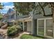 Charming townhome exterior with gray siding, lush landscaping, and inviting front entrance at 1442 Barton Place Dr, Raleigh, NC 27608
