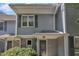 Close-up of a townhome entrance featuring gray siding, and a covered entryway at 1442 Barton Place Dr, Raleigh, NC 27608