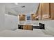 Full kitchen view featuring white countertops, oak cabinets, and black appliances at 1442 Barton Place Dr, Raleigh, NC 27608
