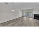 Bright living room features hardwood floors, a fireplace, and sliding glass doors at 1442 Barton Place Dr, Raleigh, NC 27608