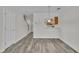 Open-concept living space showcases hardwood floors and an open view to the kitchen at 1442 Barton Place Dr, Raleigh, NC 27608