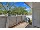 Cozy patio with white fence, landscaping, providing a private outdoor space at 1442 Barton Place Dr, Raleigh, NC 27608