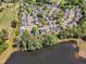 An aerial view of residential homes near a lake and golf course in a well established neighborhood at 145 Ryder Cup Cir, Raleigh, NC 27603