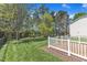 An expansive green lawn in the backyard of this home bordered by a black metal fence at 145 Ryder Cup Cir, Raleigh, NC 27603