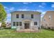 Expansive backyard featuring a patio and lush green grass, great for outdoor activities and relaxation at 145 Ryder Cup Cir, Raleigh, NC 27603