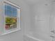 Clean, bright bathroom showcasing a modern shower-tub with window at 145 Ryder Cup Cir, Raleigh, NC 27603