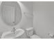 Contemporary bathroom with modern sink, toilet, mirror, and chrome towel bar at 145 Ryder Cup Cir, Raleigh, NC 27603