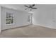 Bedroom featuring neutral carpet and a ceiling fan with two windows letting in lots of natural light at 145 Ryder Cup Cir, Raleigh, NC 27603