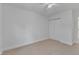 Well-lit bedroom boasting a closet and neutral carpet for a cozy and inviting feel at 145 Ryder Cup Cir, Raleigh, NC 27603
