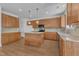 Kitchen with granite counters, stainless steel appliances, tile backsplash, and custom wood cabinets at 145 Ryder Cup Cir, Raleigh, NC 27603