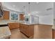 Bright eat-in kitchen with island, granite counters, modern lighting, stainless appliances, and breakfast nook at 145 Ryder Cup Cir, Raleigh, NC 27603
