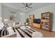 Living room featuring modern furnishings, wood floors, and a large window at 145 Ryder Cup Cir, Raleigh, NC 27603