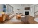 Comfortable living room with a fireplace, stylish furnishings, and bright windows at 145 Ryder Cup Cir, Raleigh, NC 27603