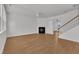 Spacious living area with a fireplace and open staircase at 145 Ryder Cup Cir, Raleigh, NC 27603