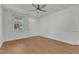 Bright, open living room featuring wood floors and a large window at 145 Ryder Cup Cir, Raleigh, NC 27603