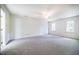 Spacious bedroom featuring plush carpeting, and an abundance of natural light from large windows at 15 Pine Ridge, Pittsboro, NC 27312