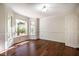 Bright dining room with large bay windows, hardwood floors, and white trim at 15 Pine Ridge, Pittsboro, NC 27312