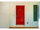 Charming entryway with a vibrant red front door and classic brass hardware at 15 Pine Ridge, Pittsboro, NC 27312