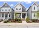 Charming two-story home with a welcoming front porch and landscaped garden at 1526 Millrock Trl, Wendell, NC 27591