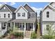 Two-story home with a inviting front porch and well-maintained landscaping at 1526 Millrock Trl, Wendell, NC 27591