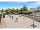 Community playground with swings, teeter-totters, and play structures, offering a fun and safe recreational area for children at 1526 Millrock Trl, Wendell, NC 27591