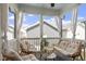 Screened porch with outdoor seating, perfect for relaxation and entertaining at 1526 Millrock Trl, Wendell, NC 27591
