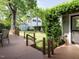 Large backyard with shade trees, wood fence, shed, and access to the home's back porch at 1811 Park Dr, Raleigh, NC 27605