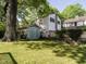 The property has spacious backyard, well-maintained lawn, storage shed, and shade trees at 1811 Park Dr, Raleigh, NC 27605