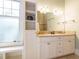 Bathroom featuring double sinks, a vanity with ample storage, natural light and a walk-in shower at 1811 Park Dr, Raleigh, NC 27605