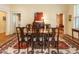 Formal dining room with wood table, chairs, rug, and access to adjacent rooms at 1811 Park Dr, Raleigh, NC 27605