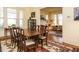 Bright dining room featuring large windows and classic furnishings, open to living area at 1811 Park Dr, Raleigh, NC 27605