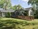 Exterior view of home with well-maintained lawn and accessible ramp leading to front door at 1811 Park Dr, Raleigh, NC 27605