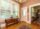 Hallway with natural light, hardwood floors, and view to adjacent rooms at 1811 Park Dr, Raleigh, NC 27605