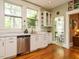 Charming kitchen featuring a stainless steel dishwasher and bright natural lighting at 1811 Park Dr, Raleigh, NC 27605