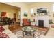 Open-concept living room with fireplace, hardwood floors, and seamless transition to the dining area at 1811 Park Dr, Raleigh, NC 27605
