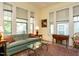 Inviting living room with neutral walls, ample natural light, and hardwood floors with a colorful rug at 1811 Park Dr, Raleigh, NC 27605
