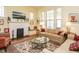 Sunlit living room with fireplace, large windows, and comfortable seating perfect for relaxation at 1811 Park Dr, Raleigh, NC 27605